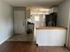 View of the kitchen showcasing modern cabinets, updated appliances, and tile flooring at 6595 Malvin Dr, Austell, GA 30168
