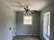 Dedicated laundry room with tile flooring, a window, and ample space for a washer and dryer at 6595 Malvin Dr, Austell, GA 30168