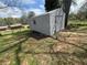 Exterior view of shed with siding and a small window; offers storage and utility space at 6595 Malvin Dr, Austell, GA 30168
