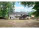 Back exterior view of house with deck and large backyard at 2278 Smith Sw Ave, Marietta, GA 30064