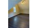 Large bedroom with dark laminate floors and a window at 4684 Pine Dr, Loganville, GA 30052