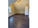 Bright bedroom featuring laminate wood floor and ceiling fan at 4684 Pine Dr, Loganville, GA 30052