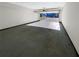 Spacious garage with concrete floor and a view of the front yard at 60 Hammock Dr, Covington, GA 30016