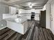 Modern kitchen featuring white cabinets, stainless steel appliances, and a granite countertop at 60 Hammock Dr, Covington, GA 30016