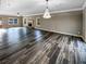 Large living room features hardwood floors, crown molding, and a fireplace at 60 Hammock Dr, Covington, GA 30016