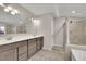 Bathroom features a dual sink vanity, a shower, and a soaking tub at 147 Stargaze Rdg, Canton, GA 30114