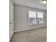 Spacious bedroom features large windows and neutral carpeting at 147 Stargaze Rdg, Canton, GA 30114