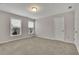 Bright bedroom with carpet, windows, and a neutral color palette at 147 Stargaze Rdg, Canton, GA 30114