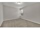 Neutral toned empty bedroom with a large window at 147 Stargaze Rdg, Canton, GA 30114