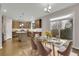 Elegant dining area adjacent to the kitchen with modern table setting and natural light at 147 Stargaze Rdg, Canton, GA 30114