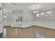 A formal dining room with hardwood floors, wainscoting, and a chandelier at 147 Stargaze Rdg, Canton, GA 30114