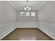 Bright dining room with crown molding, neutral paint, and modern chandelier at 147 Stargaze Rdg, Canton, GA 30114