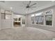 Bright, open living room with large windows and neutral carpet, open to the kitchen at 147 Stargaze Rdg, Canton, GA 30114