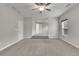 Living room with neutral tones, ceiling fan, with steps leading to another room at 147 Stargaze Rdg, Canton, GA 30114