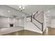 Bright living room with a fireplace and staircase at 147 Stargaze Rdg, Canton, GA 30114