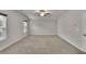 Spacious living room features neutral tones, large window, and ceiling fan at 147 Stargaze Rdg, Canton, GA 30114