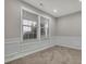 Cozy living room featuring crown molding and bright windows at 147 Stargaze Rdg, Canton, GA 30114