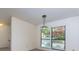 Cozy dining room with modern lighting, large windows, and a view of outside foliage at 811 Wynnes Ridge Se Cir, Marietta, GA 30067