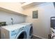 Functional laundry room with washer and dryer included at 811 Wynnes Ridge Se Cir, Marietta, GA 30067