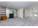 Spacious living room with a fireplace, built-in shelving, and gray carpeting at 811 Wynnes Ridge Se Cir, Marietta, GA 30067