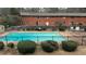 Community swimming pool with surrounding fence and landscaping at 1608 Briarcliff Ne Rd # 4, Atlanta, GA 30306