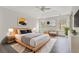 Main bedroom with light wood platform bed, large windows, and hardwood floors at 539 Easton Dr, Locust Grove, GA 30248