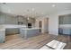 Modern kitchen with gray cabinets and a large island at 2711 Dolce Rd, Dacula, GA 30019