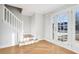 Bright entryway with hardwood floors, staircase, and a view through French doors at 277 Edison Dr, Stockbridge, GA 30281