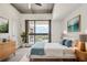 Inviting bedroom features a neutral color palette, a large window with natural light, and stylish furnishings at 563 Memorial Se Dr # 503, Atlanta, GA 30312