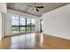 Bright bedroom with hardwood flooring, large window and modern ceiling fan at 563 Memorial Se Dr # 503, Atlanta, GA 30312