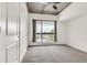 Bright bedroom featuring carpet flooring, a large window, and a ceiling fan at 563 Memorial Se Dr # 503, Atlanta, GA 30312