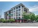 Modern condominium building featuring a corner restaurant space, ample windows, and inviting balconies at 563 Memorial Se Dr # 503, Atlanta, GA 30312