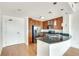 Bright kitchen features wood cabinets, granite countertops, stainless steel appliances and a large island for extra counter space at 563 Memorial Se Dr # 503, Atlanta, GA 30312