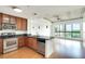 Modern kitchen flows into a spacious living area with wood floors and large windows bringing in plenty of natural light at 563 Memorial Se Dr # 503, Atlanta, GA 30312