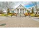 Elegant community clubhouse with columns and landscaping at 5671 Radford Loop, Fairburn, GA 30213