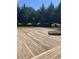 Spacious deck surrounded by trees, includes hot tub, great for gatherings at 1565 Dr Bramblett Rd, Cumming, GA 30028