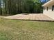 Expansive wooden deck featuring a hot tub and offering space for outdoor entertaining at 1565 Dr Bramblett Rd, Cumming, GA 30028