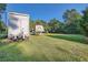 Expansive grassy lot featuring a Montana camper and storage container at 1565 Dr Bramblett Rd, Cumming, GA 30028