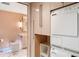 Bright bathroom featuring modern fixtures, marble floors and a Miele washer and dryer at 75 14Th St # 3640, Atlanta, GA 30309