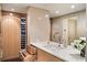 Contemporary bathroom with marble vanity, wine storage and modern fixtures at 75 14Th St # 3640, Atlanta, GA 30309