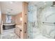 Luxury bathroom with marble flooring, soaking tub, and glass shower at 75 14Th St # 3640, Atlanta, GA 30309