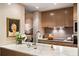 Modern kitchen with marble countertops, light wood cabinets, and integrated appliances at 75 14Th St # 3640, Atlanta, GA 30309