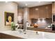 Elegant kitchen showcasing marble countertops, modern faucet, and sleek cabinetry, seamlessly integrated into the home's design at 75 14Th St # 3640, Atlanta, GA 30309