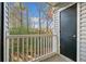 Balcony with white railing overlooking wooded area and black storage closet at 1115 Cannongate Sw Xing, Marietta, GA 30064