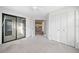 Spacious bedroom with closet, sliding glass door, and neutral carpet at 1115 Cannongate Sw Xing, Marietta, GA 30064