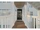 Covered entrance walkway with white railings leading to the front door at 1115 Cannongate Sw Xing, Marietta, GA 30064