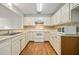 Traditional kitchen with white cabinetry, laminate countertops, and tiled backsplash at 1115 Cannongate Sw Xing, Marietta, GA 30064