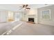 Open concept living room showcasing fireplace and ample natural light at 1115 Cannongate Sw Xing, Marietta, GA 30064