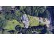 Aerial view of a home with a sprawling yard, mature trees and a circular driveway at 3368 Ashford Dunwoody Rd, Atlanta, GA 30319