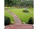 Beautiful backyard with brick path, fountain and manicured lawn at 3368 Ashford Dunwoody Rd, Atlanta, GA 30319